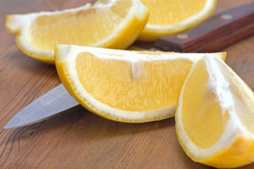 sliced lemon and knife