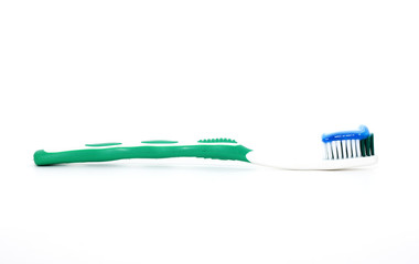 Tooth brush with tooth paste on white background.