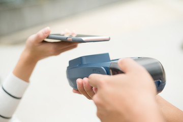 Fototapeta premium Customer pay on the bill with mobile phone