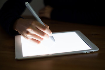 Woman using pen write on tablet pc