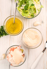 pink sauce and vinaigrette dressing in glass bowl