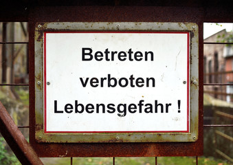 german "danger, do not enter" signboard in an old industry areal. 