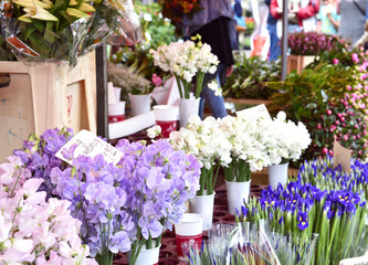 Fototapeta na wymiar Flower market. Market stall with various fresh flowers and selective focus. 