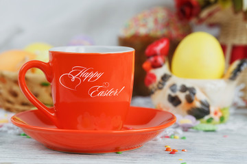 Table setting for Easter - Easter cakes, coffee cup and colored