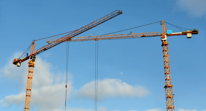 Two lifting tower cranes
