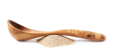 Wooden spoon over the pile of yeast