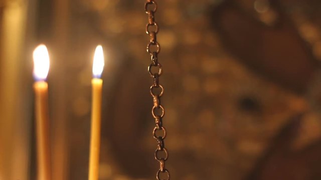 burning candles in the Church lampstands