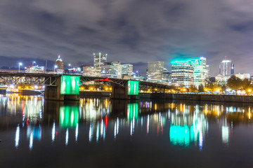 water with reflection and cityscape and skyline of portland at n