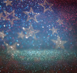 glitter vintage lights background. blue, silver and black. defocused.
