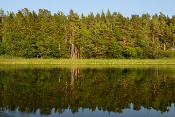 Aland Islands, Finland. Evening landscape. Reflection in water