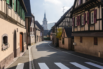 Street with half-timbered houses in the village of Andlau on a sunny autumn day,  Alsace, France