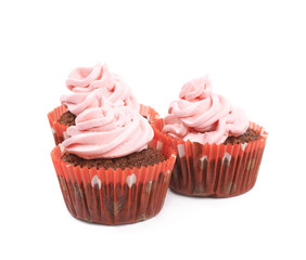 Chocolate muffin with pink cream isolated