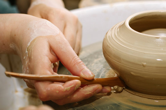 pottery. the teacher teaches the student work on the potter's wheel