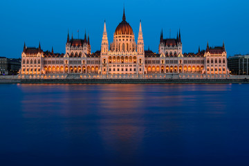 Budapest Parliament building with the Danube in blue hour, illuminated 