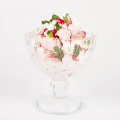 Cottage cheese with radish and chives in a cup