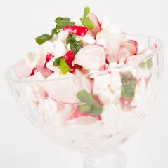 Cottage cheese with radish and chives in a cup