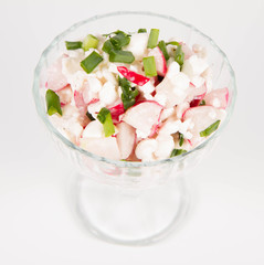 Cottage cheese with radish and chives in a cup