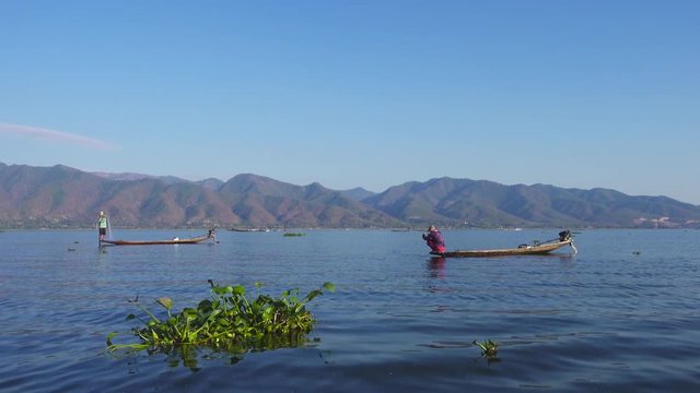 Fishermen in a canoe fishing in the famous Inle Lake, 4k
