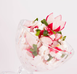 Fototapeta na wymiar Cottage cheese with radish and chives in a cup