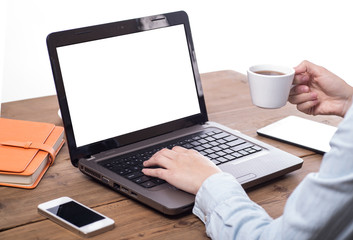 Fototapeta premium Businessman sitting in front of computer monitor and analyzing d