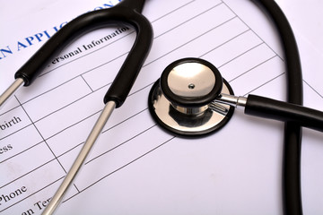 Hospital form with stethoscope on top