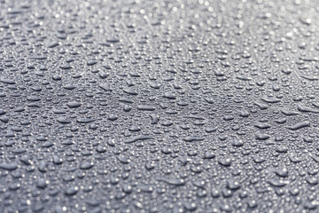 water drops on a metallic surface