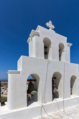 White bell tower in Pyrgos Kallistis, Santorini island, Thira, Cyclades, Greece