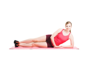 Obraz premium Fit woman in sportswear doing physical exercises