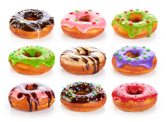 Donuts with colored glaze and chocolate, isolated on white backg