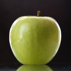 green apple on a dark background/green apple on a dark background