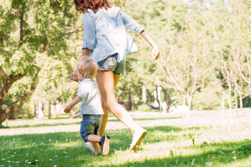 Mother having a walk with her son in the park