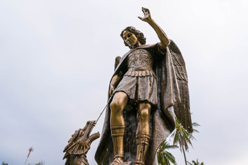 Archangel Michael Sculpture, The archangel at Wooden church (Unseen Thailand Project) isolated against a blue sky.