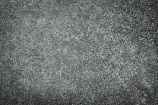 Rough grey stone tile background.