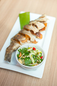 Deep fried fish with Thai salad.