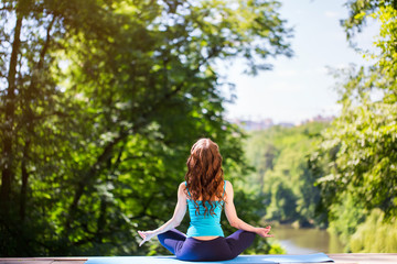 Girl doing exercises in the park.