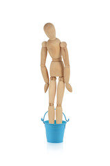 wooden dummy with empty bucket