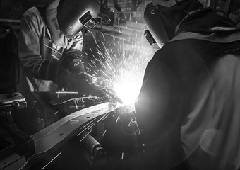 welder Industrial automotive part in factory black white