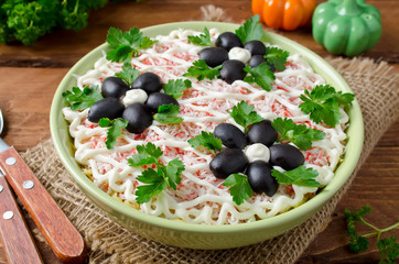 Salad with crab sticks, cheese, egg and prunes