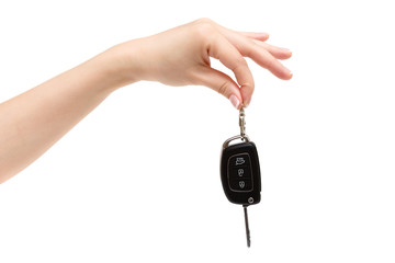Female hand holds car keys.