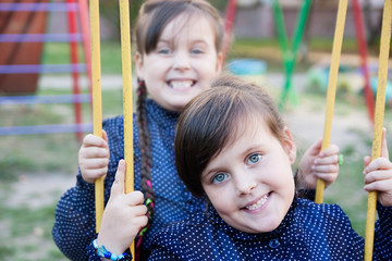 children grimaces at the playground