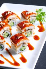 DRAGON SPECIAL MAKI : Grilled Eel ,Kaiware Sprouts,Cucumber and Sesame maki by Fresh Avocado with Special Soy Sauce.