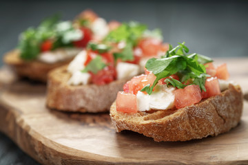 homemade bruschetta with cheese and vegetables, shallow focus