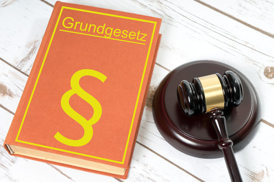 Statute book / Statute book with the German words fundamental law and Judges gavel