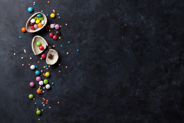 Colorful candies on stone background