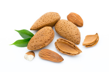 Almonds with leaves isolated on white background