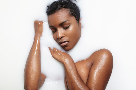 black woman in a milk bath