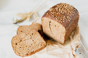 Black sliced bread with fresh coriander closeup