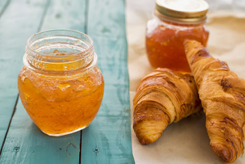 Healthy breakfast with croissants and orange jam