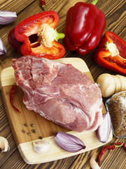 raw pork with vegetables and spices