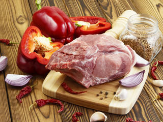 raw pork with vegetables and spices